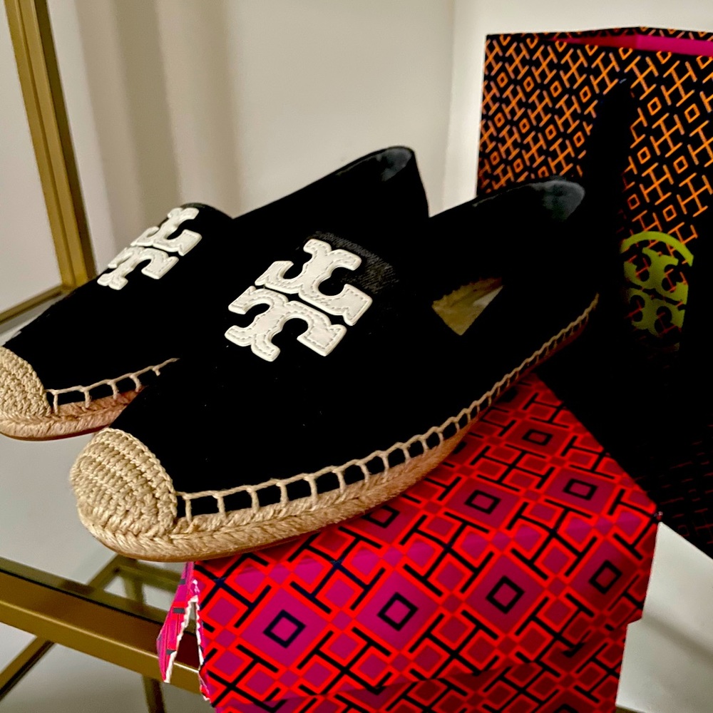 Tory Bruch black slip on espadrilles.
